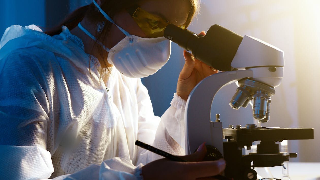 A forensic scientist analyzing evidence in a laboratory