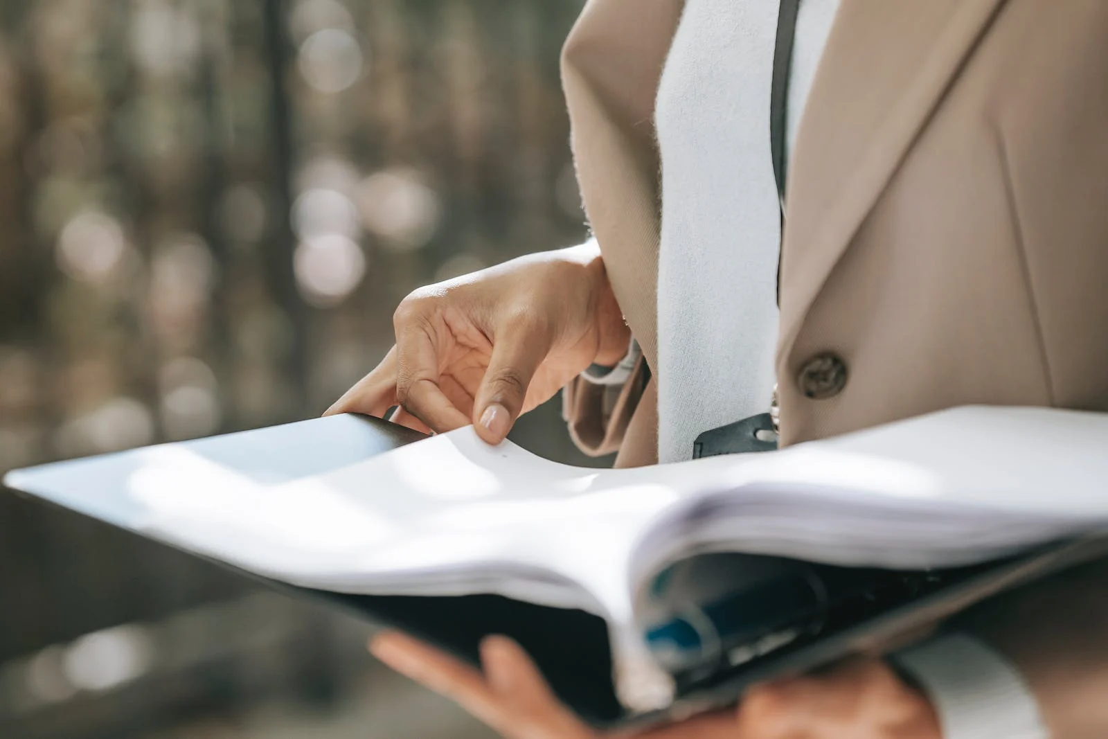 A person looking at a document highlighting the importance of BSA compliance for financial institutions.