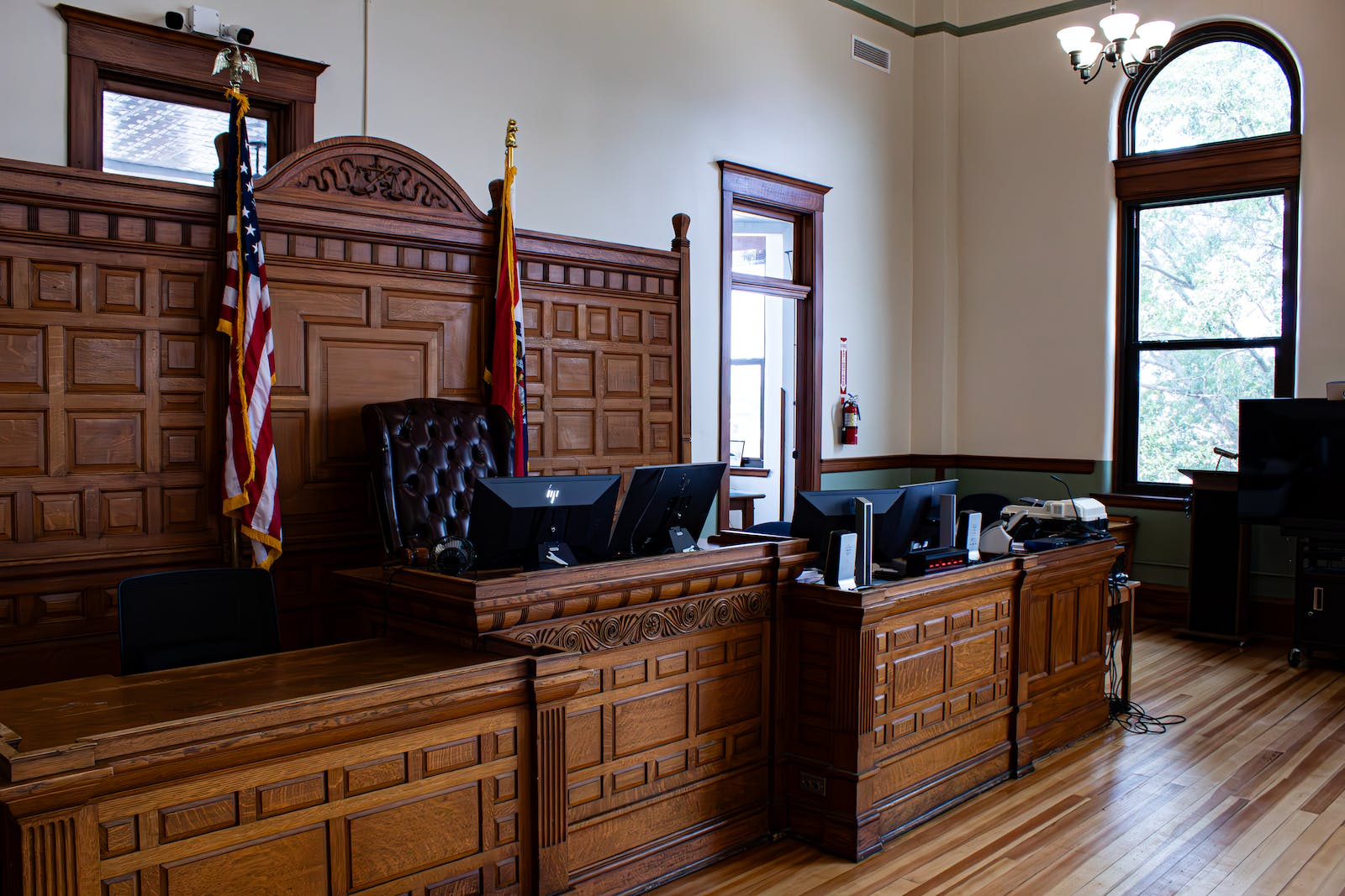A picture of a courtroom, representing the legal ramifications and enforcement actions of fraud.